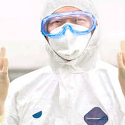 Lab technician in protective clothing