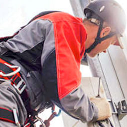 Technician using safety harness